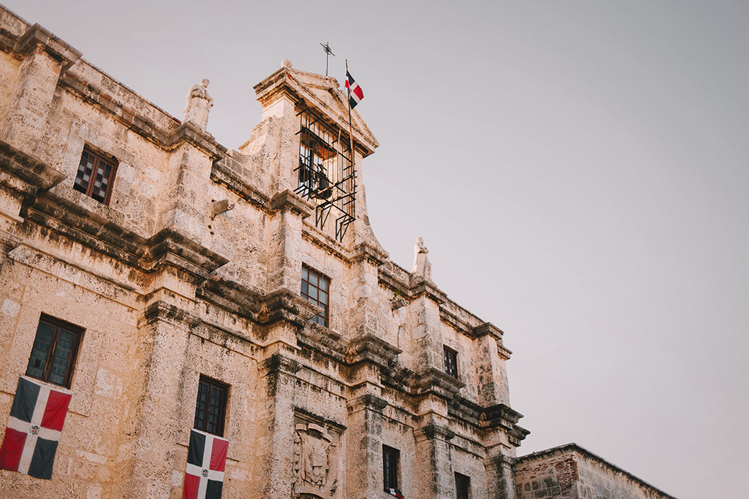 Imposing church with flags of The Dominican Republic